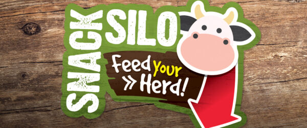 Snack Silo. Text reads "Feed your herd". There is a cow and a red arrow on the image